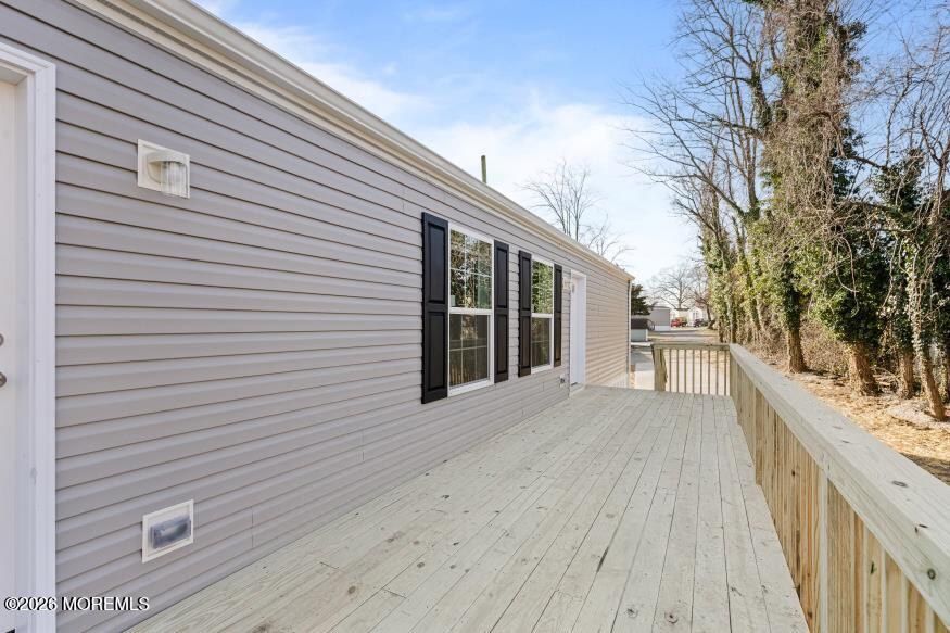 1820 State Rte 35, Unit 16 Wall, NJ 07719 - Photo 23 of 24 a view of a house with a deck