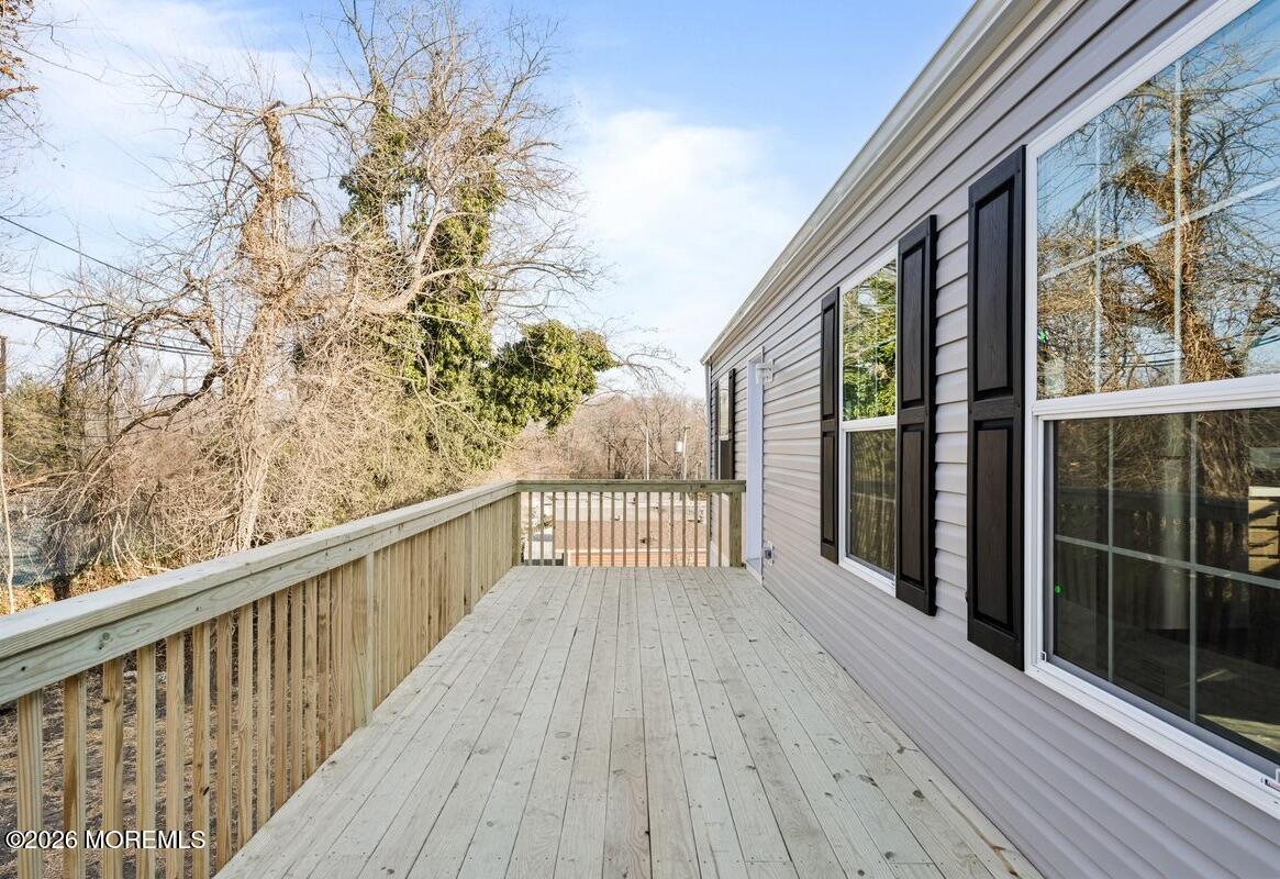 1820 State Rte 35, Unit 16 Wall, NJ 07719 - Photo 4 of 24 a view of balcony with wooden floor