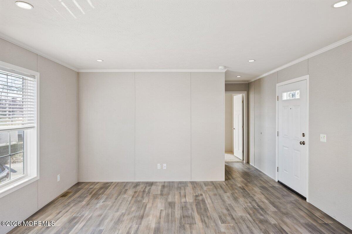 1820 State Rte 35, Unit 16 Wall, NJ 07719 - Photo 5 of 24 wooden floor in an empty room with a window
