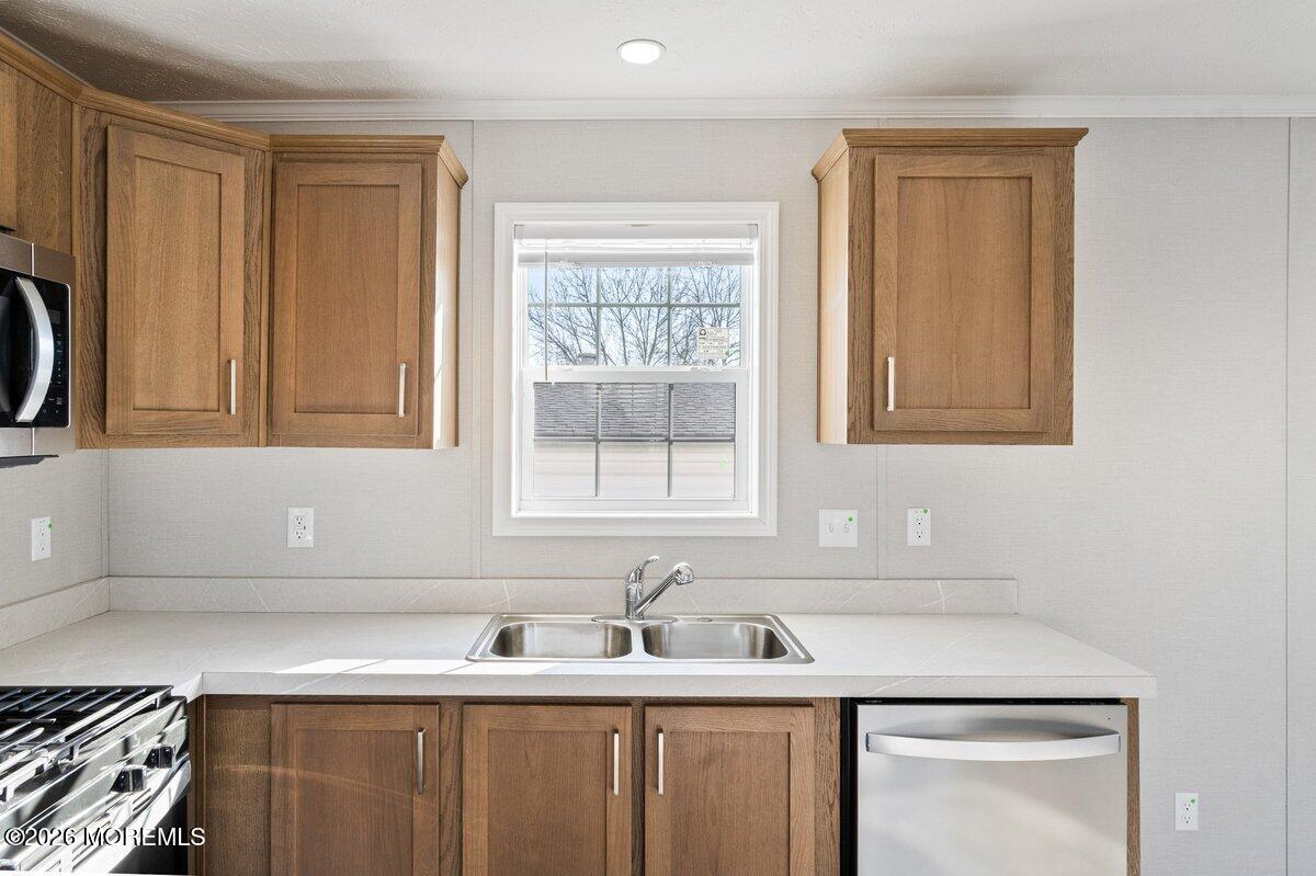 1820 State Rte 35, Unit 16 Wall, NJ 07719 - Photo 9 of 24 a kitchen with a sink cabinets and window