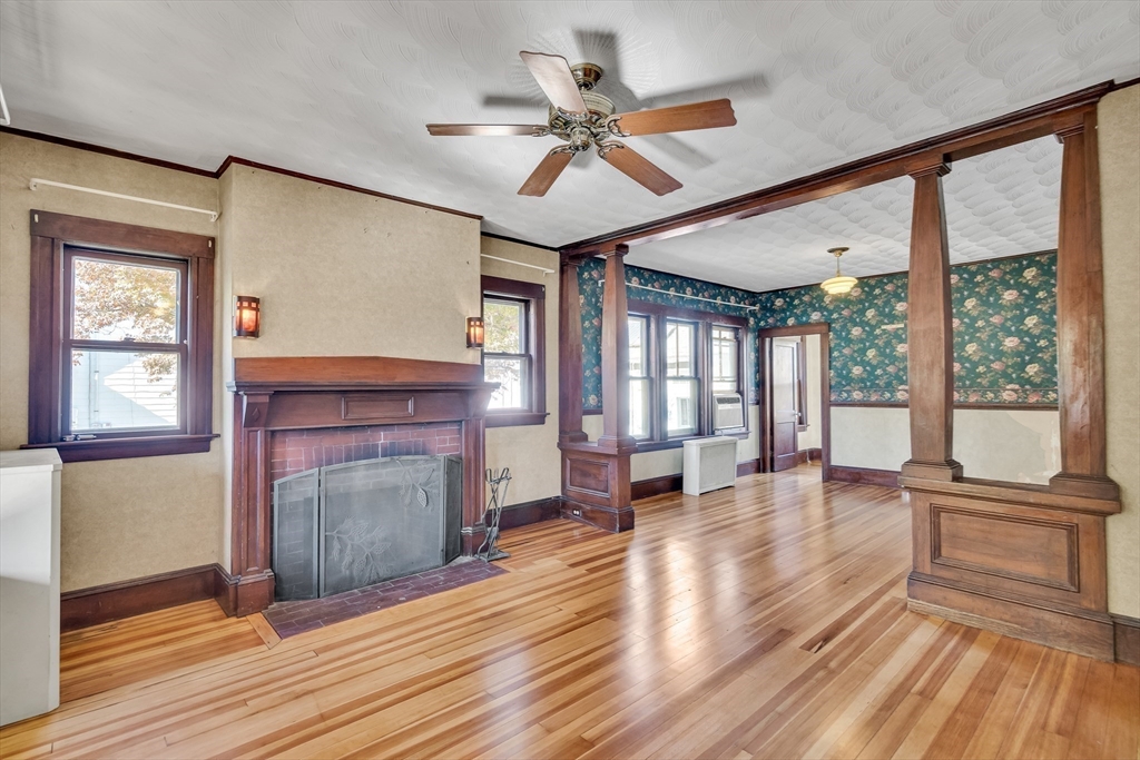 219 Pelham Street Methuen, MA 01844 - Photo 11 of 39 a living room with furniture and a fireplace