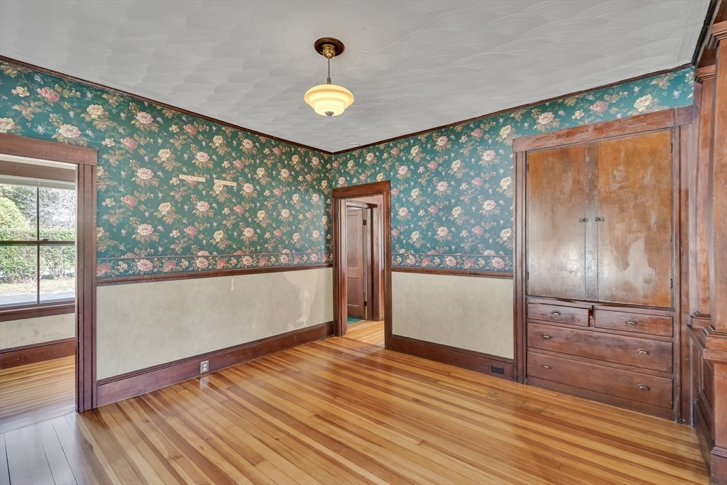 219 Pelham Street Methuen, MA 01844 - Photo 15 of 39 wooden floor in an empty room with a window
