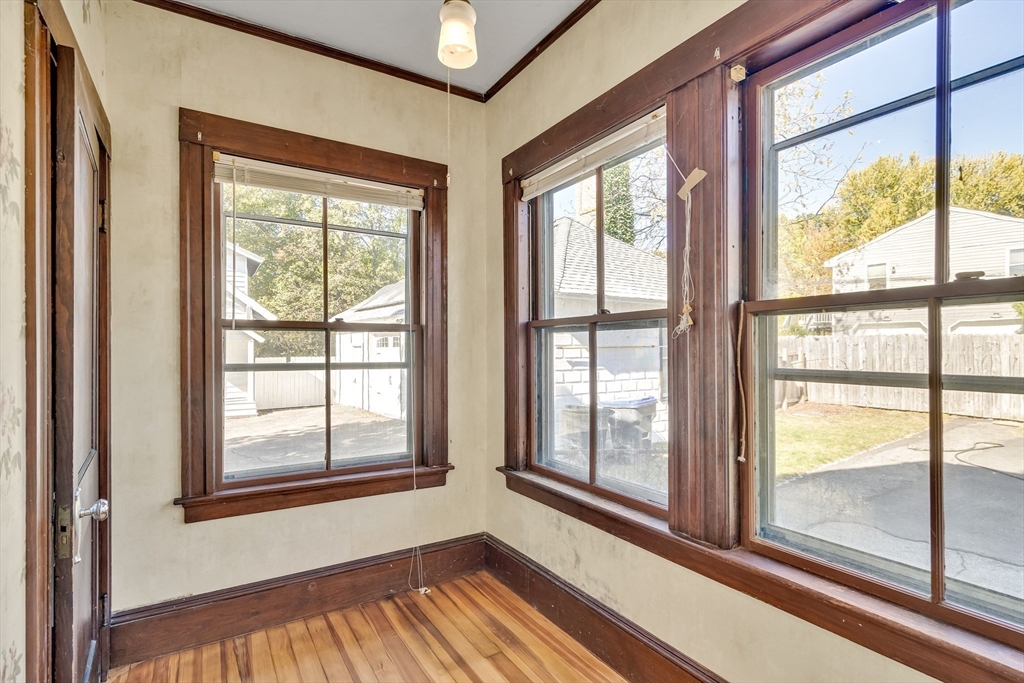 219 Pelham Street Methuen, MA 01844 - Photo 17 of 39 a view of an empty room with wooden floor and a window