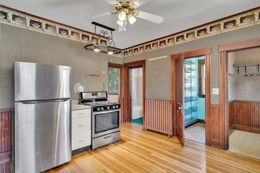 219 Pelham Street Methuen, MA 01844 - Photo 20 of 39 a kitchen with stainless steel appliances a refrigerator and a stove top oven