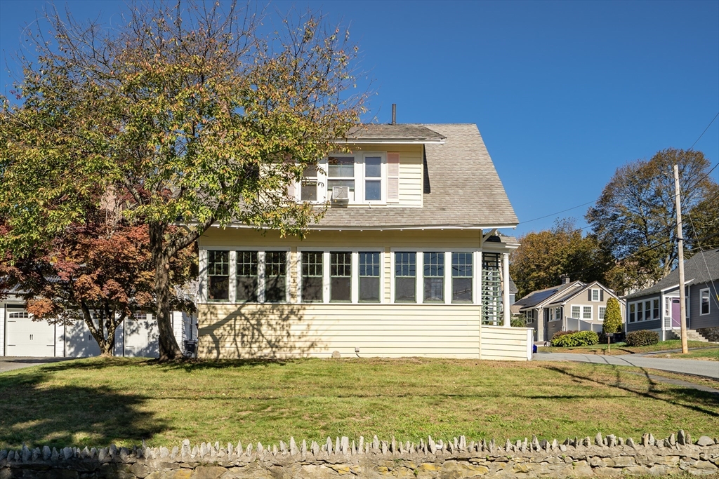 219 Pelham Street Methuen, MA 01844 - Photo 2 of 39 a front view of a house with a garden