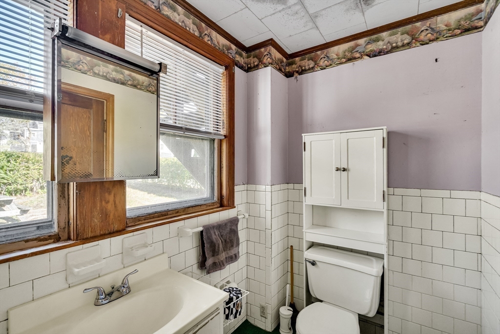219 Pelham Street Methuen, MA 01844 - Photo 22 of 39 a bathroom with a sink mirror toilet and shower
