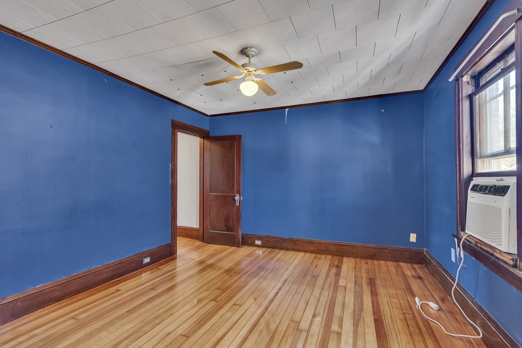 219 Pelham Street Methuen, MA 01844 - Photo 25 of 39 a view of empty room with wooden floor and fan