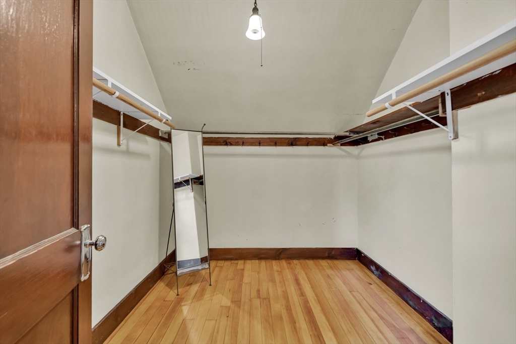 219 Pelham Street Methuen, MA 01844 - Photo 28 of 39 a view of walk in closet with empty racks