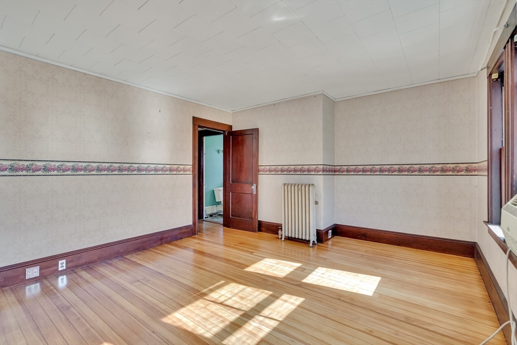 219 Pelham Street Methuen, MA 01844 - Photo 30 of 39 a view of a room with wooden floor and chair
