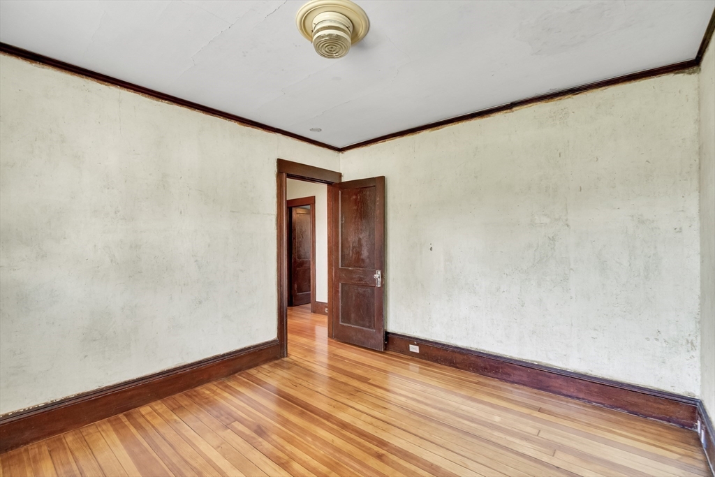 219 Pelham Street Methuen, MA 01844 - Photo 31 of 39 a view of empty room with wooden floor