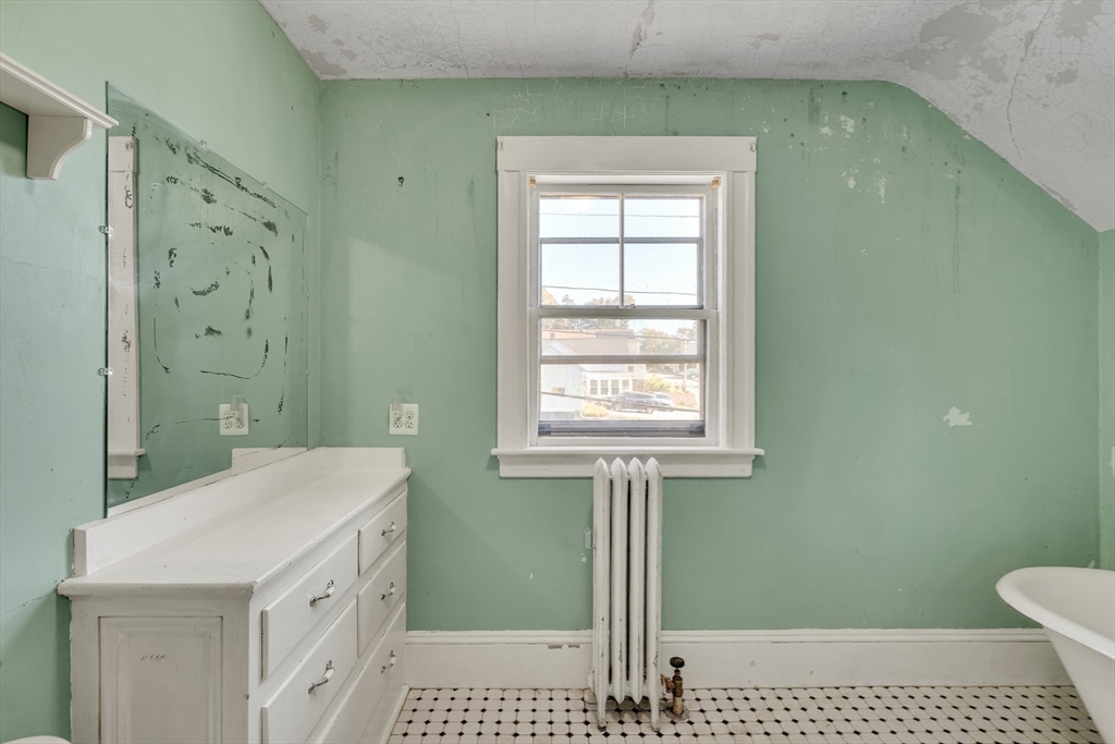 219 Pelham Street Methuen, MA 01844 - Photo 37 of 39 a bathroom with a sink a toilet and shower