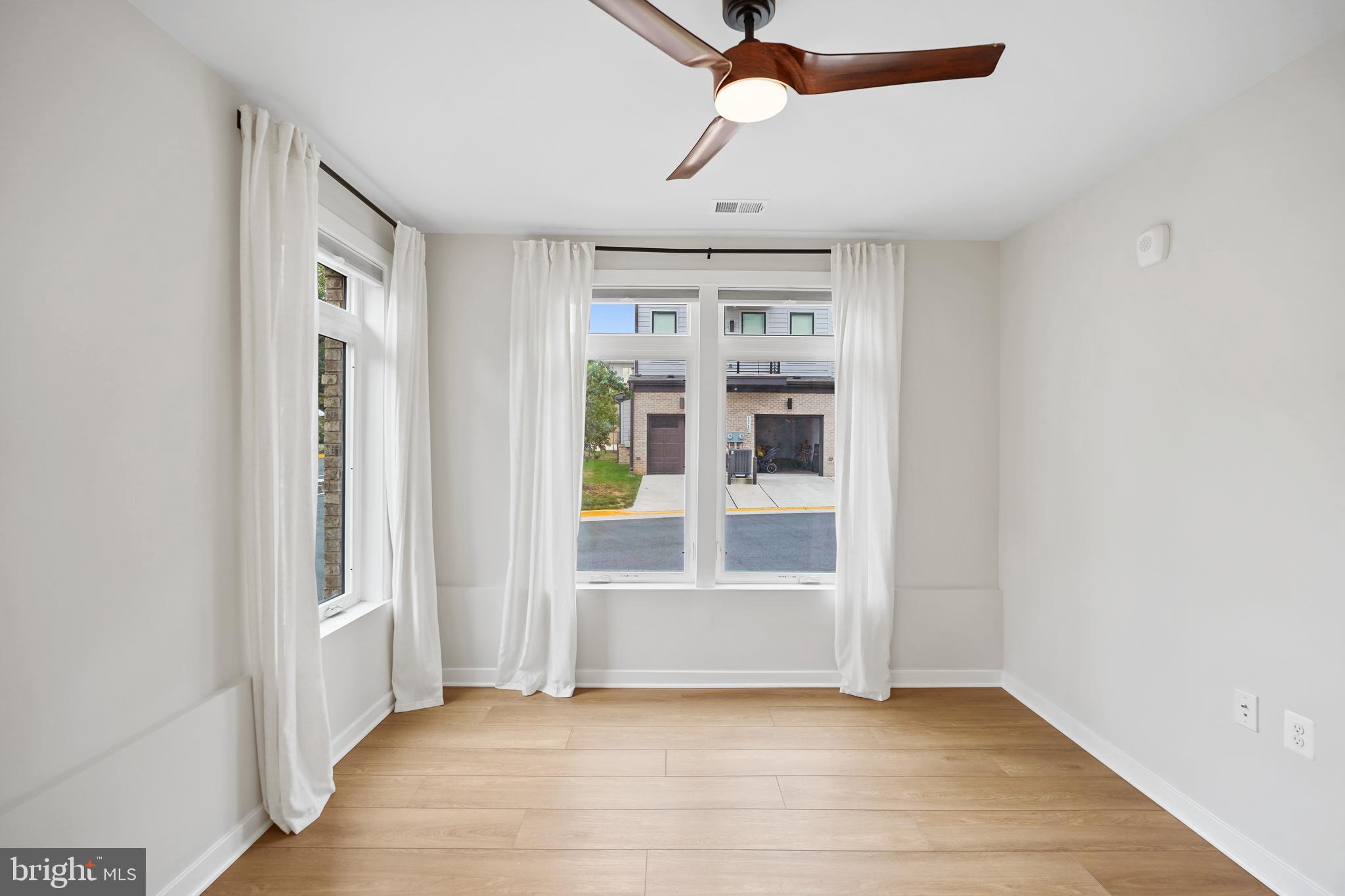 1675 Bandit Loop, Unit 107B Reston, VA 20190 - Photo 11 of 36 a view of an empty room with a window