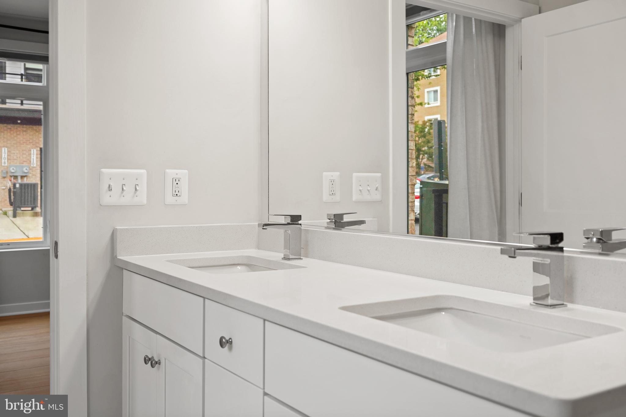 1675 Bandit Loop, Unit 107B Reston, VA 20190 - Photo 13 of 36 a bathroom with a sink and a mirror