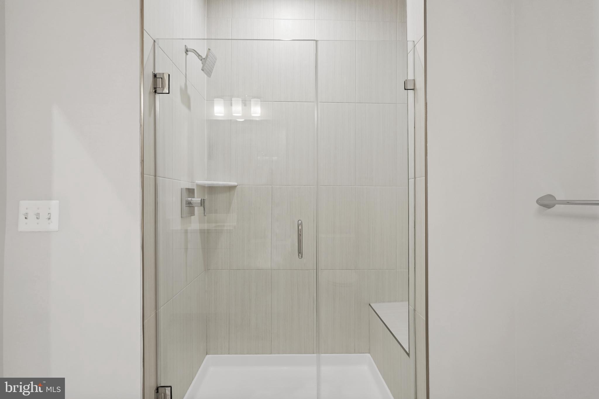 1675 Bandit Loop, Unit 107B Reston, VA 20190 - Photo 14 of 36 a bathroom with a shower