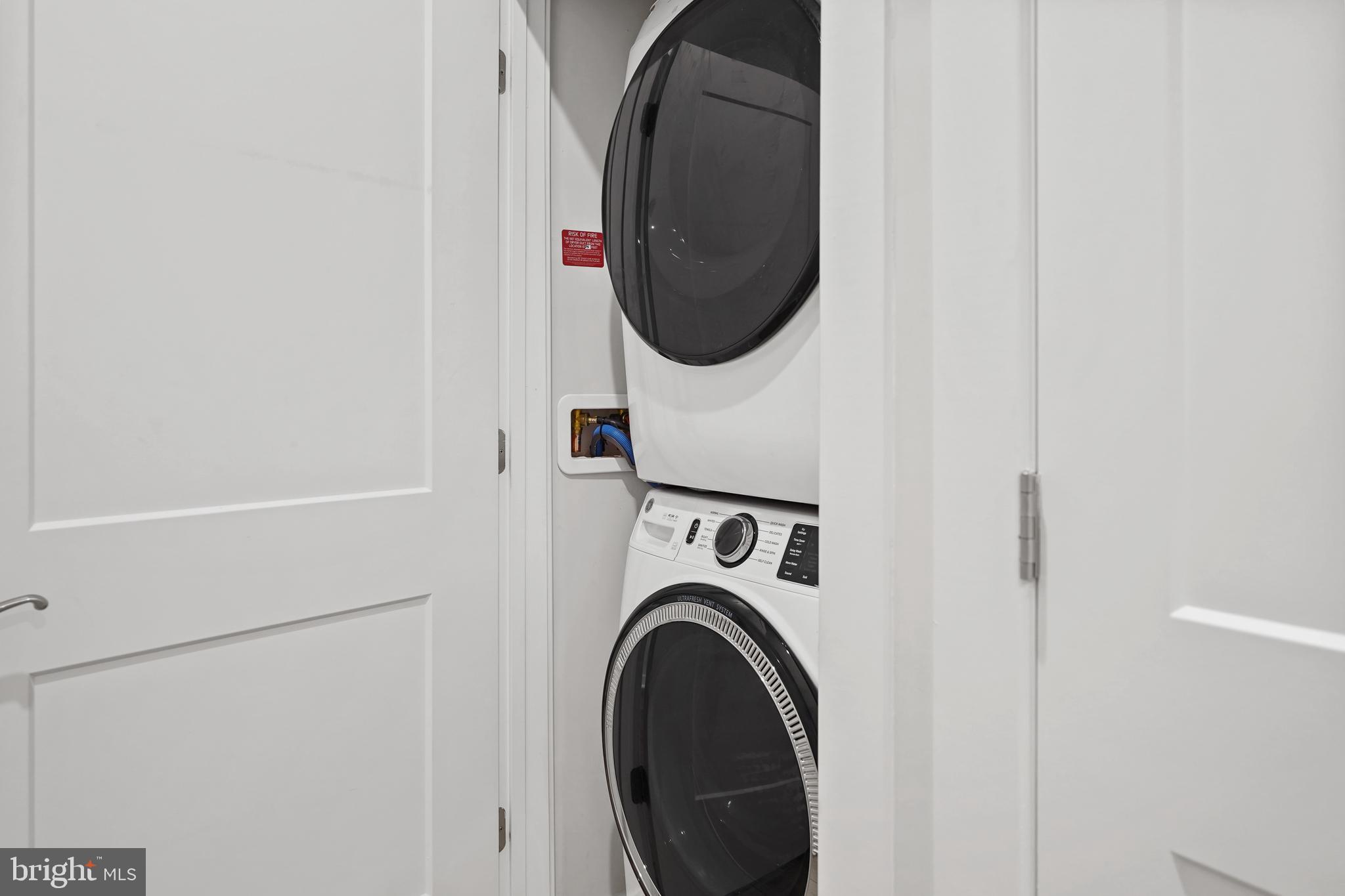 1675 Bandit Loop, Unit 107B Reston, VA 20190 - Photo 23 of 36 a utility room with dryer and washer