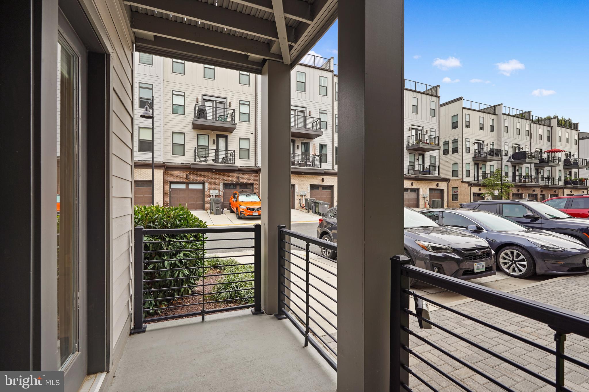 1675 Bandit Loop, Unit 107B Reston, VA 20190 - Photo 28 of 36 a car parked in front of a building