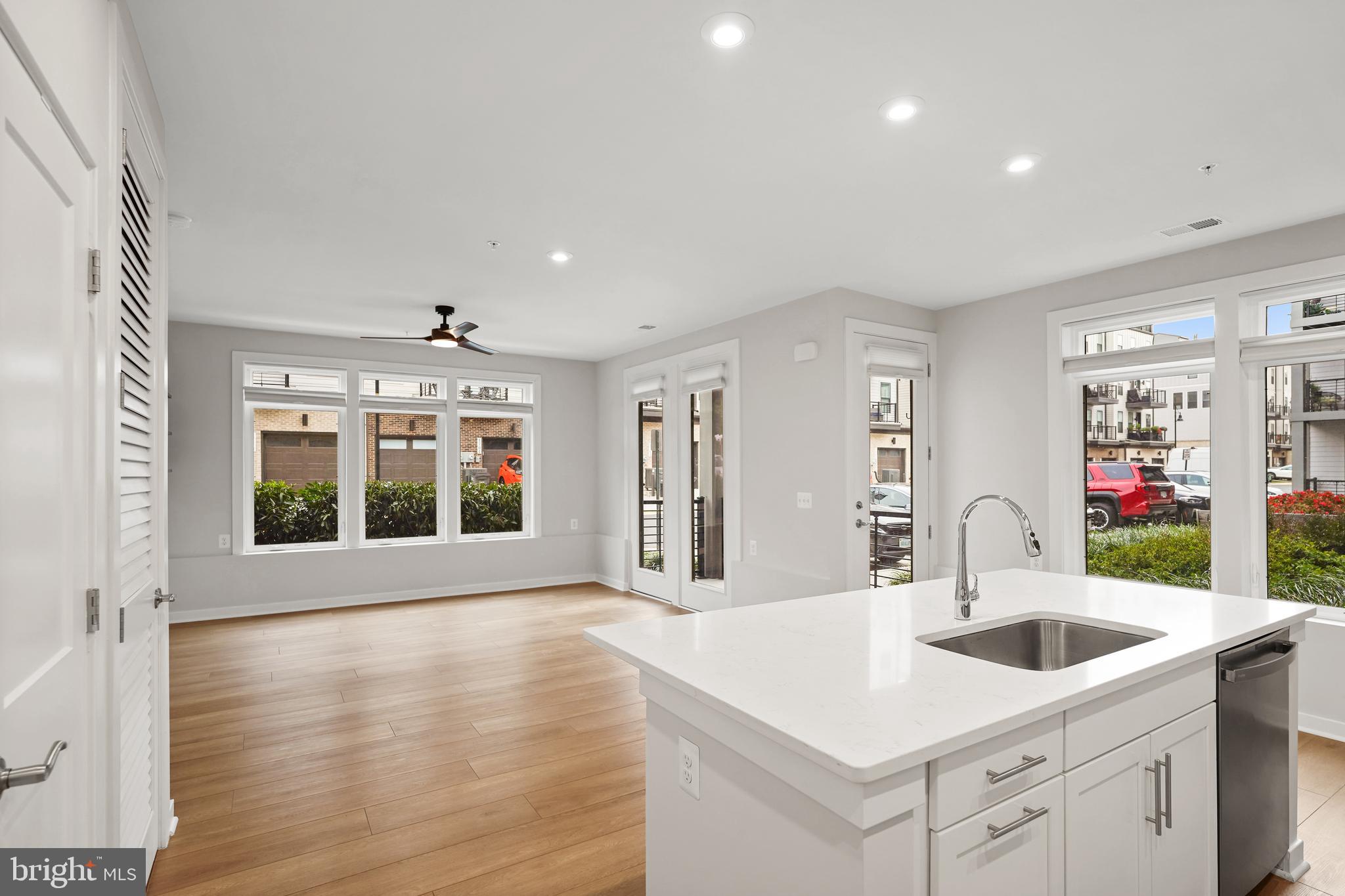 1675 Bandit Loop, Unit 107B Reston, VA 20190 - Photo 3 of 36 a kitchen with sink and refrigerator