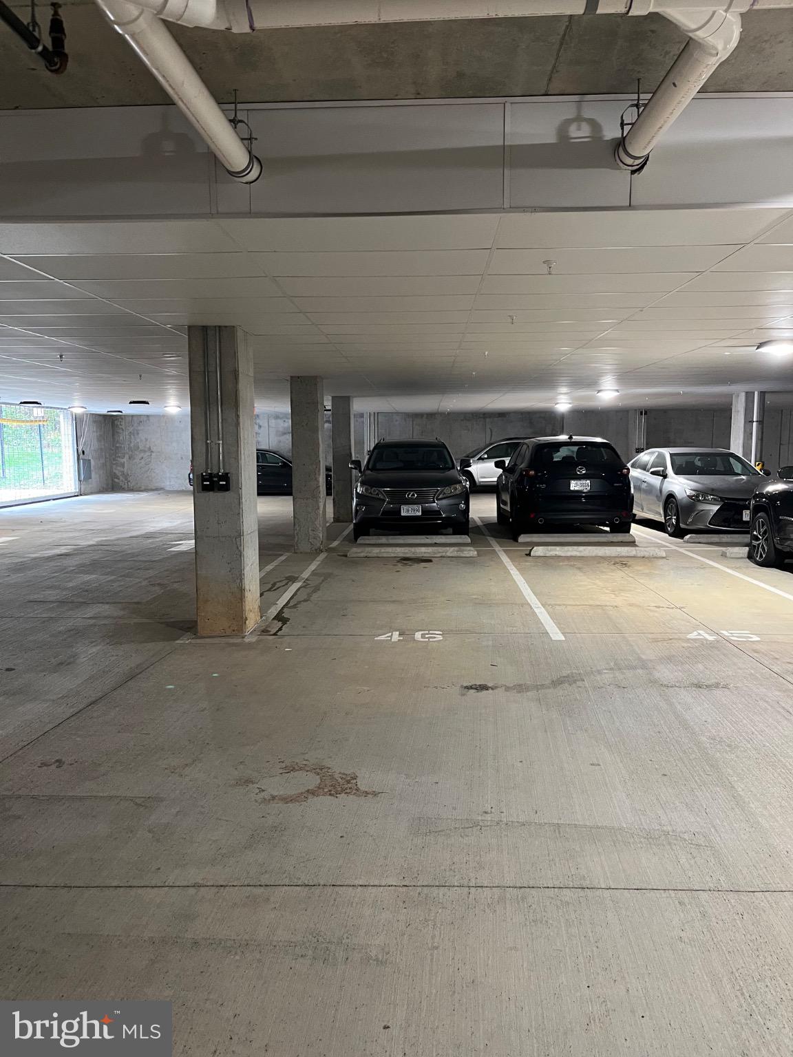 1675 Bandit Loop, Unit 107B Reston, VA 20190 - Photo 33 of 36 a view of parking garage with cars