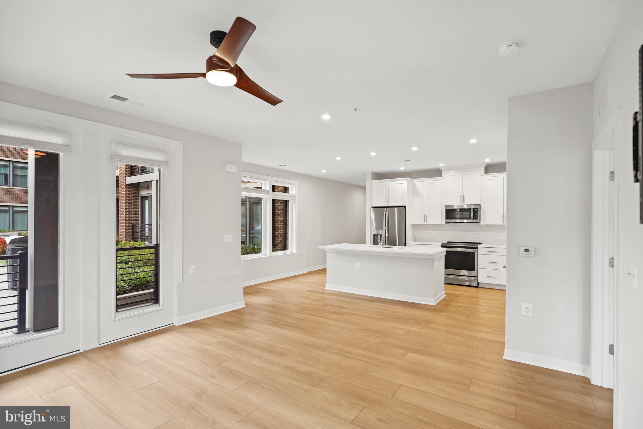 1675 Bandit Loop, Unit 107B Reston, VA 20190 - Photo 9 of 36 a view of kitchen with sink microwave and refrigerator