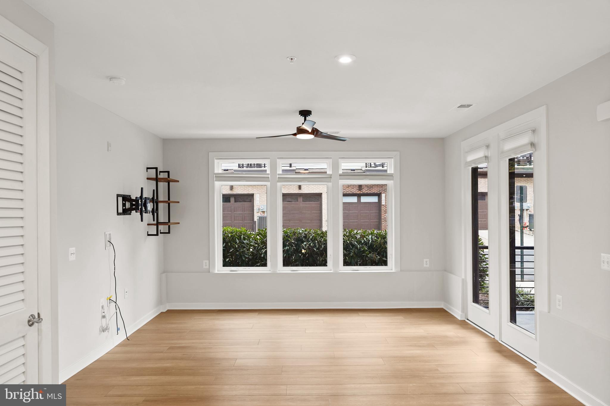 1675 Bandit Loop, Unit 107B Reston, VA 20190 - Photo 10 of 36 a view of an empty room with a window