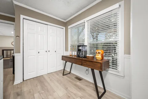 a kitchen with stainless steel appliances granite countertop a sink and a refrigerator