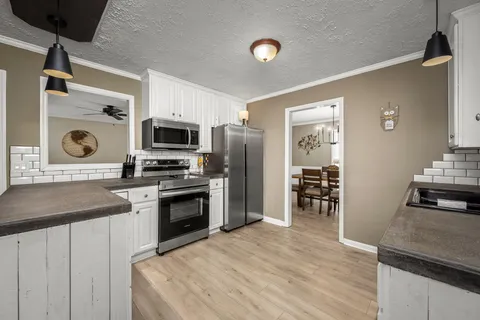 a dining room with furniture and window