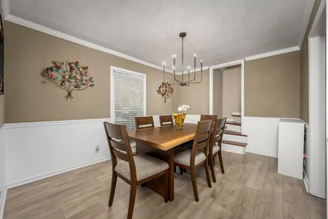 a bedroom with a bed and a television