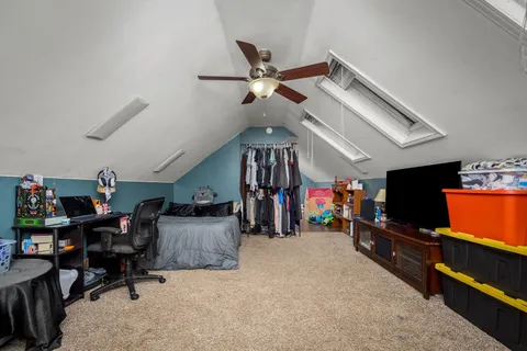 a view of a storage area with wooden shelves