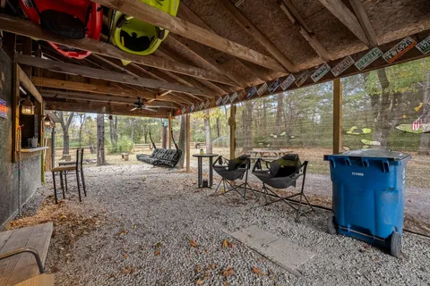 a front view of a house with a yard covered with green space