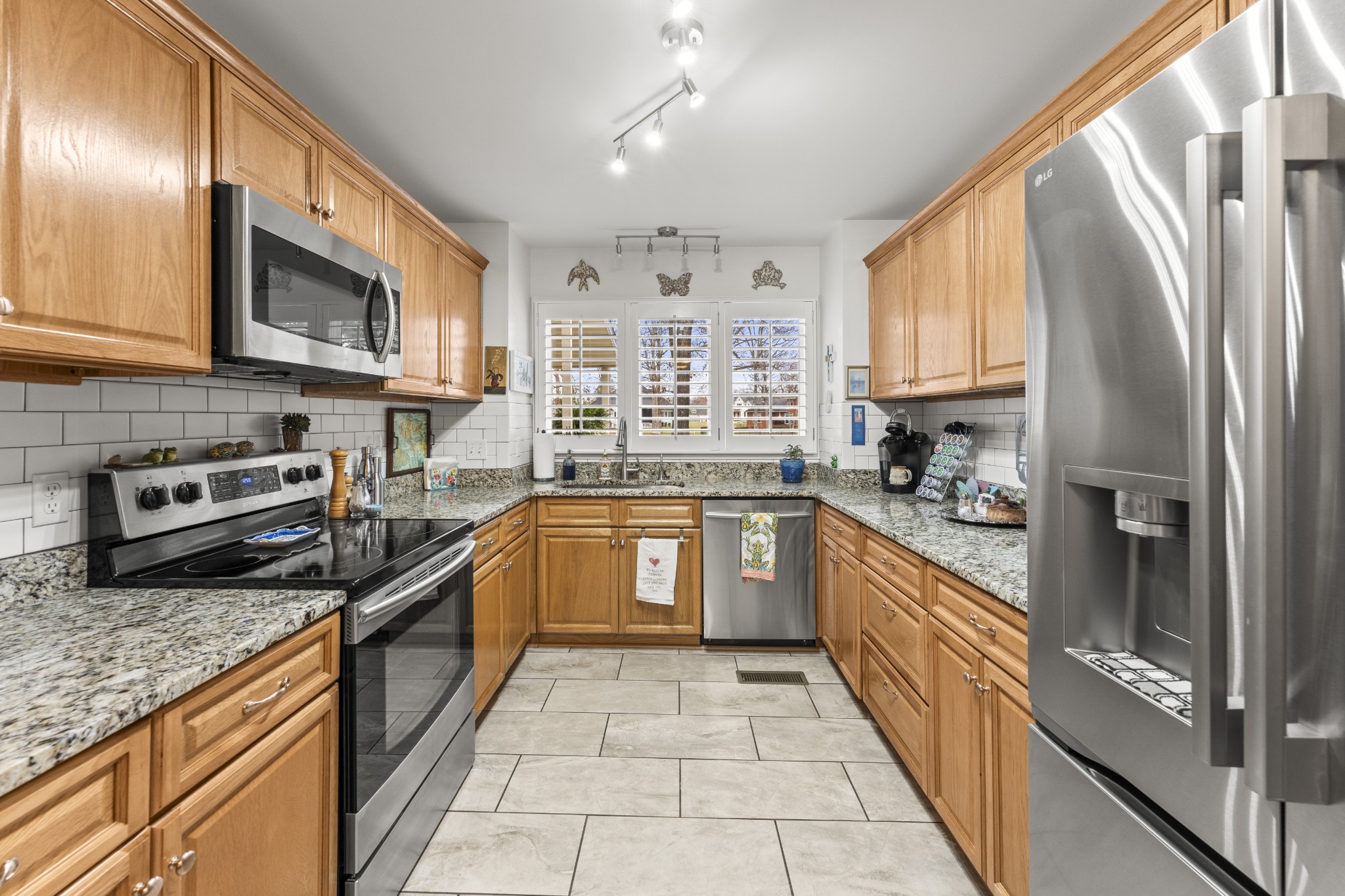 6 Chadsworth Place Tullahoma, TN 37388 - Photo 11 of 49 a kitchen with stainless steel appliances granite countertop a stove sink and cabinets