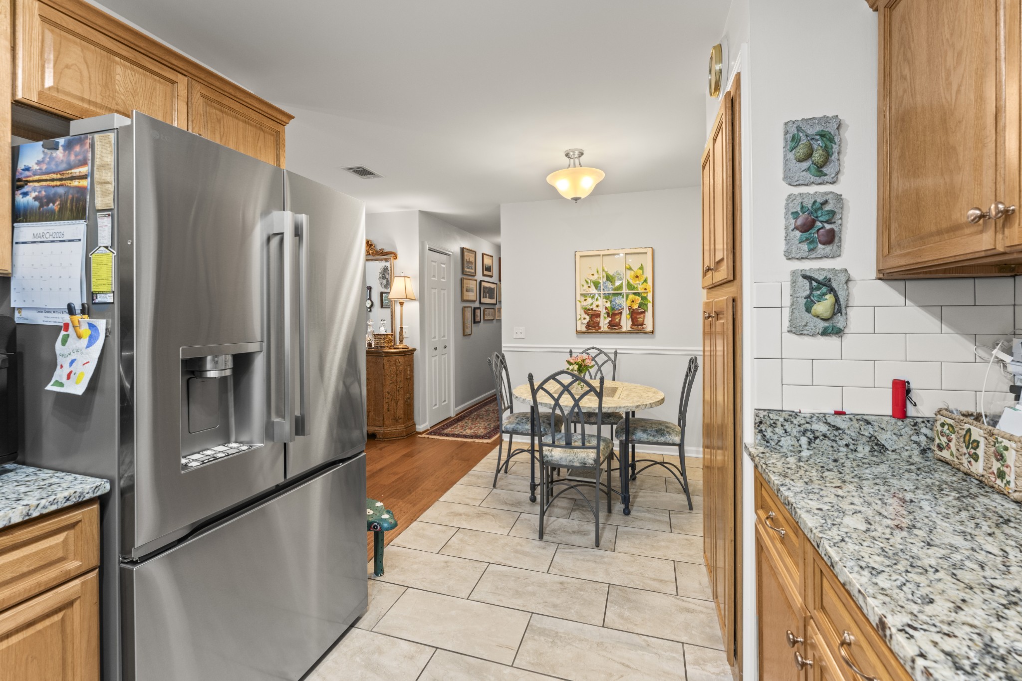 6 Chadsworth Place Tullahoma, TN 37388 - Photo 13 of 49 a kitchen with granite countertop a refrigerator and stove