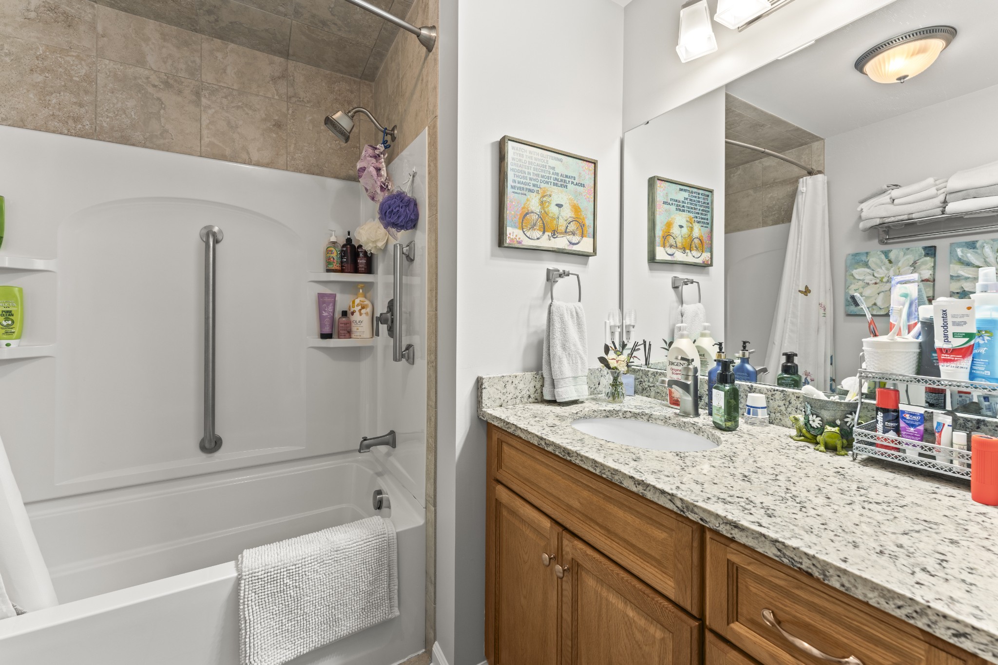 6 Chadsworth Place Tullahoma, TN 37388 - Photo 18 of 49 a bathroom with a granite countertop tub sink and mirror