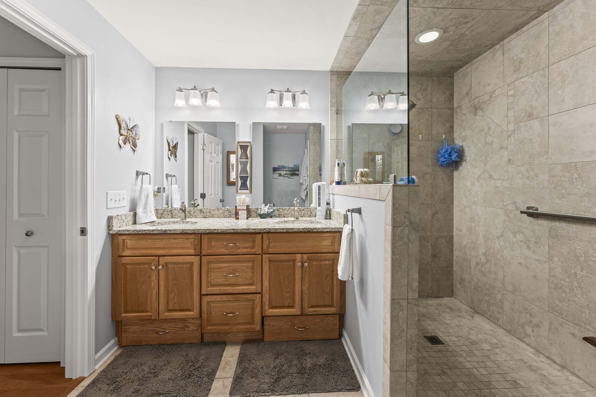 6 Chadsworth Place Tullahoma, TN 37388 - Photo 25 of 49 a bathroom with a shower sink and mirror