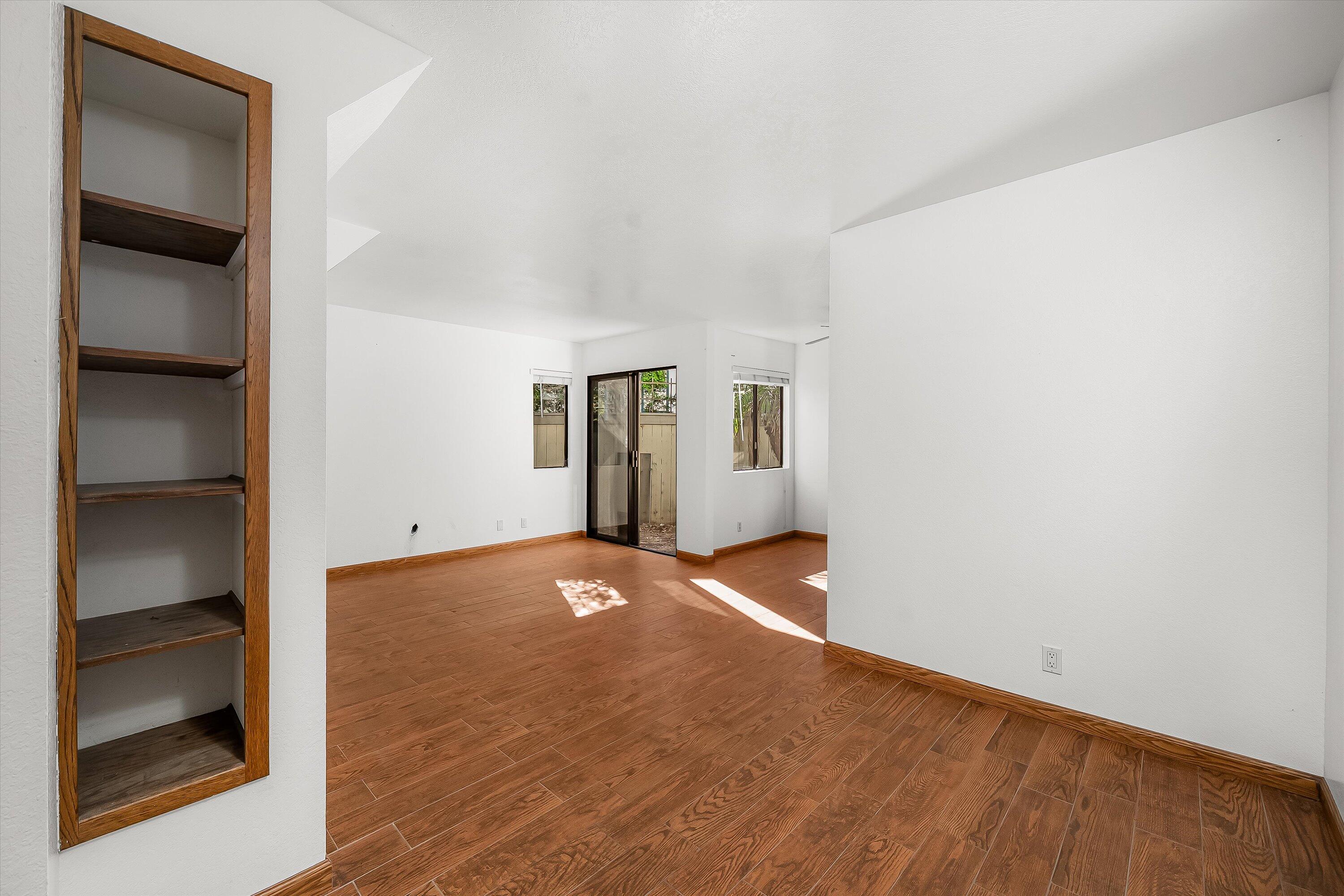 522 West Victoria Street, Unit B Santa Barbara, CA 93101 - Photo 3 of 21 a view of an empty room with a window and wooden floor