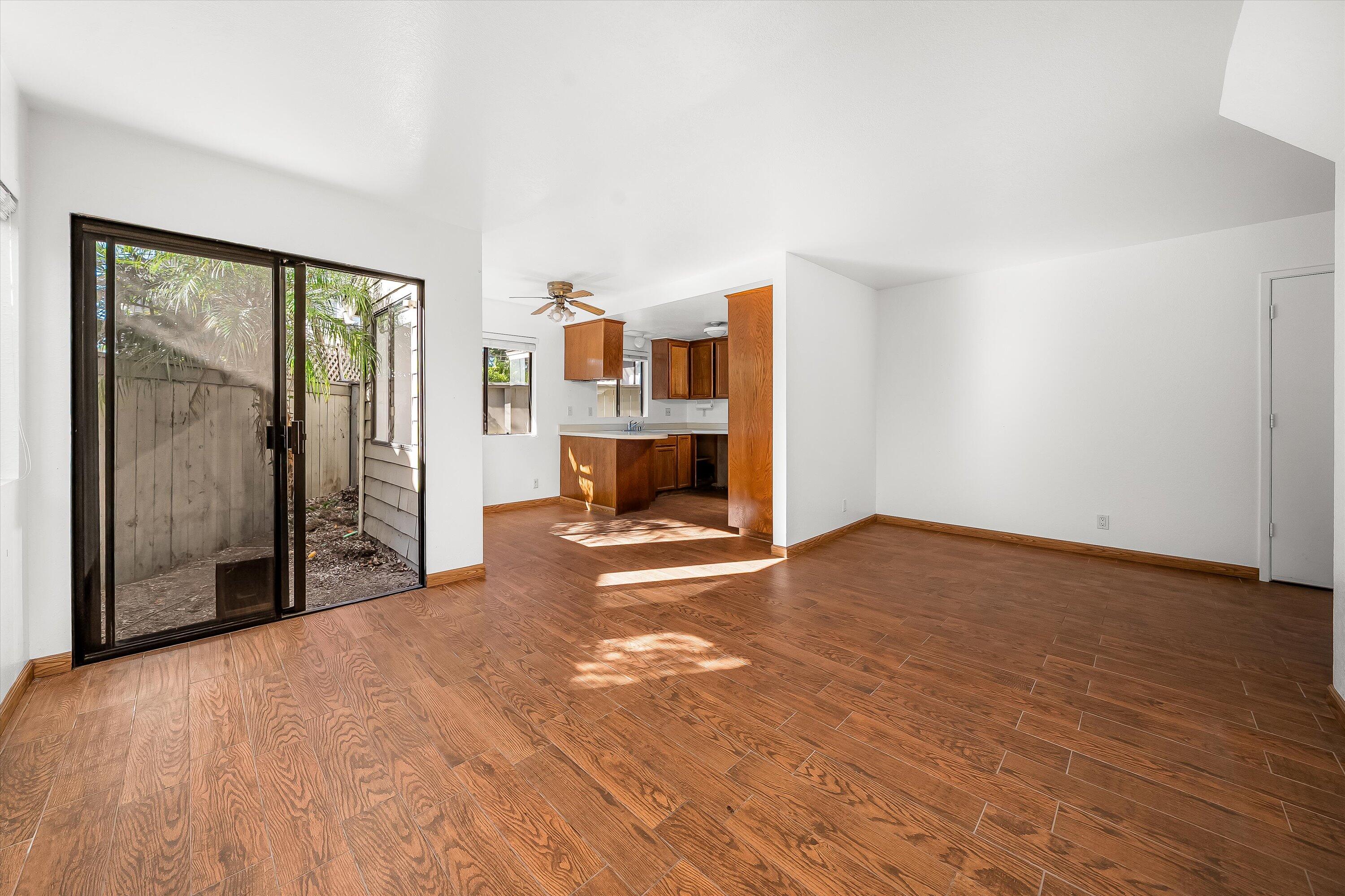 522 West Victoria Street, Unit B Santa Barbara, CA 93101 - Photo 8 of 21 a view of empty room with wooden floor and fan