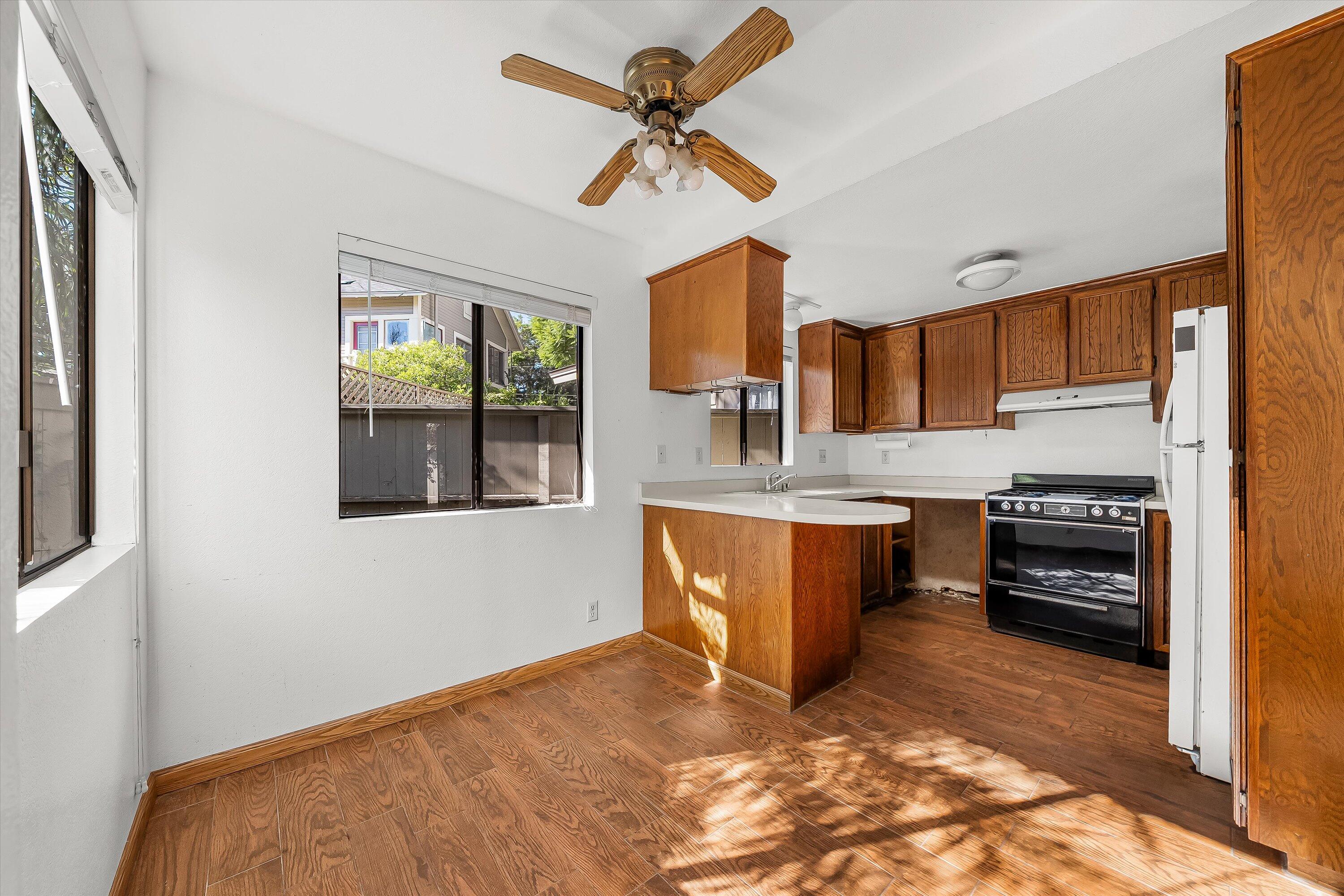 522 West Victoria Street, Unit B Santa Barbara, CA 93101 - Photo 10 of 21 a kitchen with stainless steel appliances granite countertop a stove a sink and a refrigerator