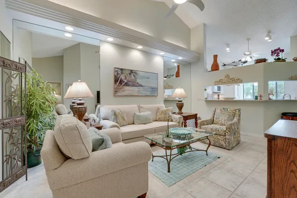 a living room with furniture and a lamp