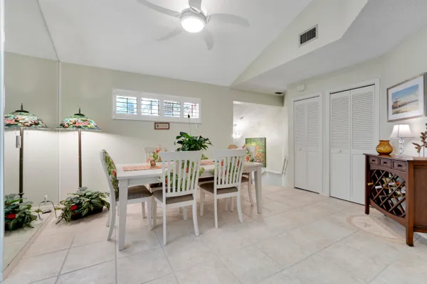 a dining room with furniture and window