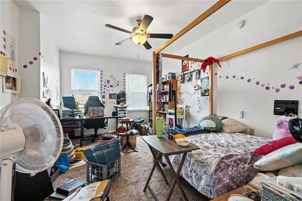 3037 Pulawski Way Pittsburgh, PA 15219 - Photo 18 of 26 a living room with furniture and a chandelier