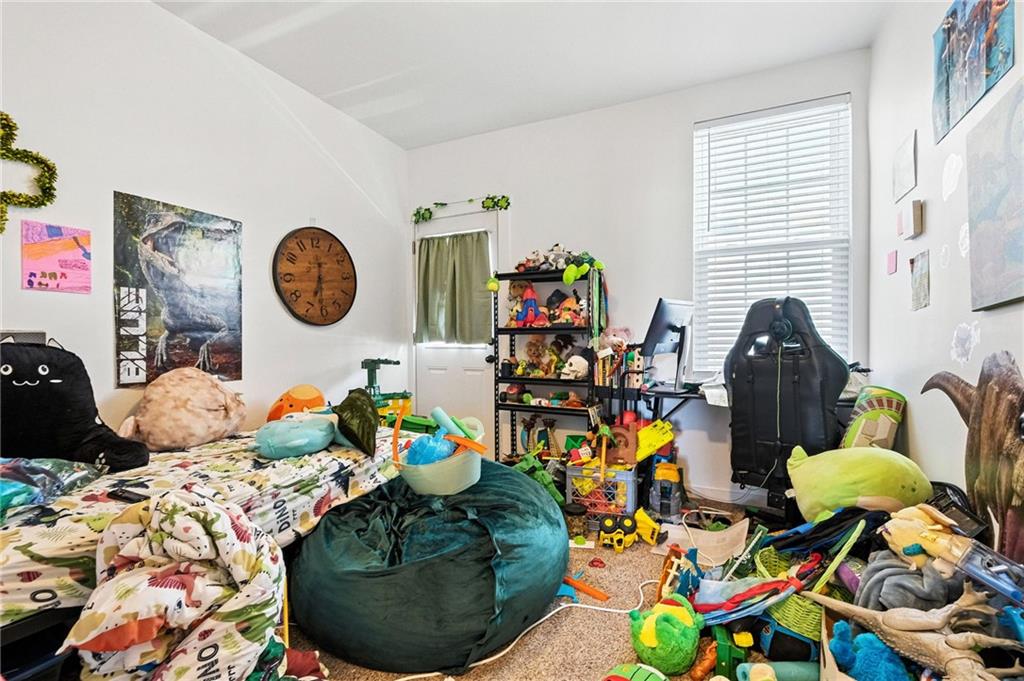 3037 Pulawski Way Pittsburgh, PA 15219 - Photo 19 of 26 a living room filled with furniture and toys