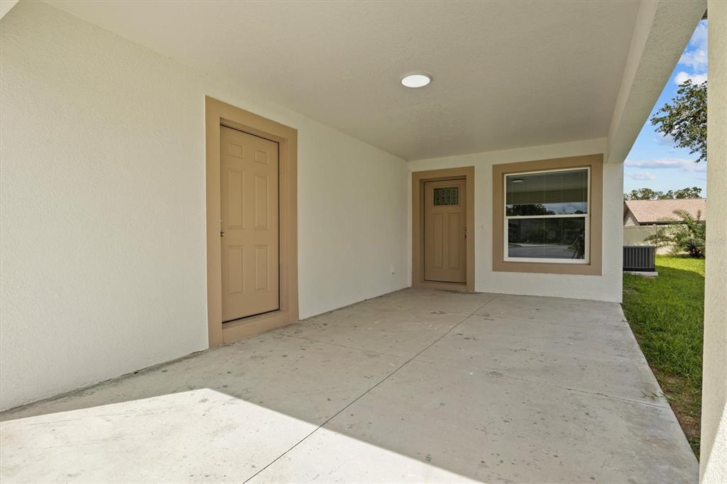 4078 Oak Loop Mulberry, FL 33860 - Photo 2 of 19 a view of a house with a yard and garage