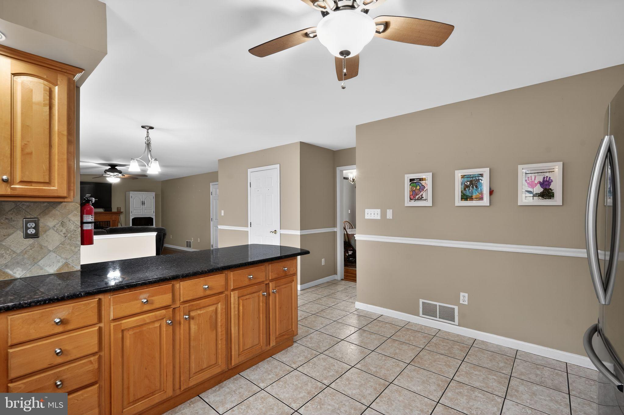 740 Carpenter Street Glassboro, NJ 08028 - Photo 14 of 44 Inviting kitchen with warm wood accents.