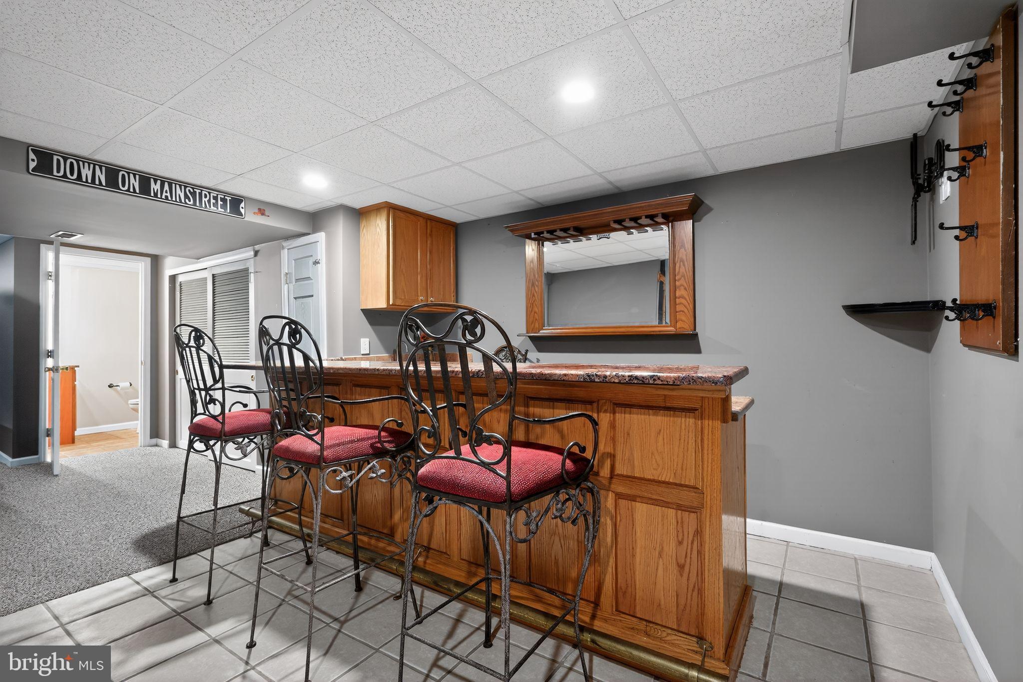 740 Carpenter Street Glassboro, NJ 08028 - Photo 35 of 44 Charming basement bar with inviting ambiance.