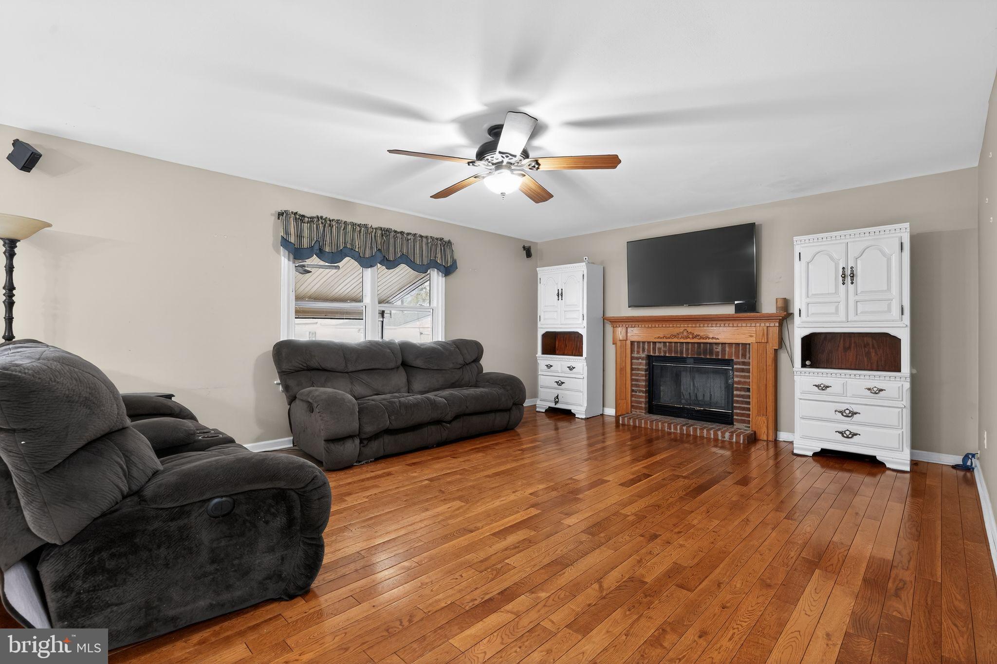 740 Carpenter Street Glassboro, NJ 08028 - Photo 7 of 44 Spacious living area with warm wooden floors.