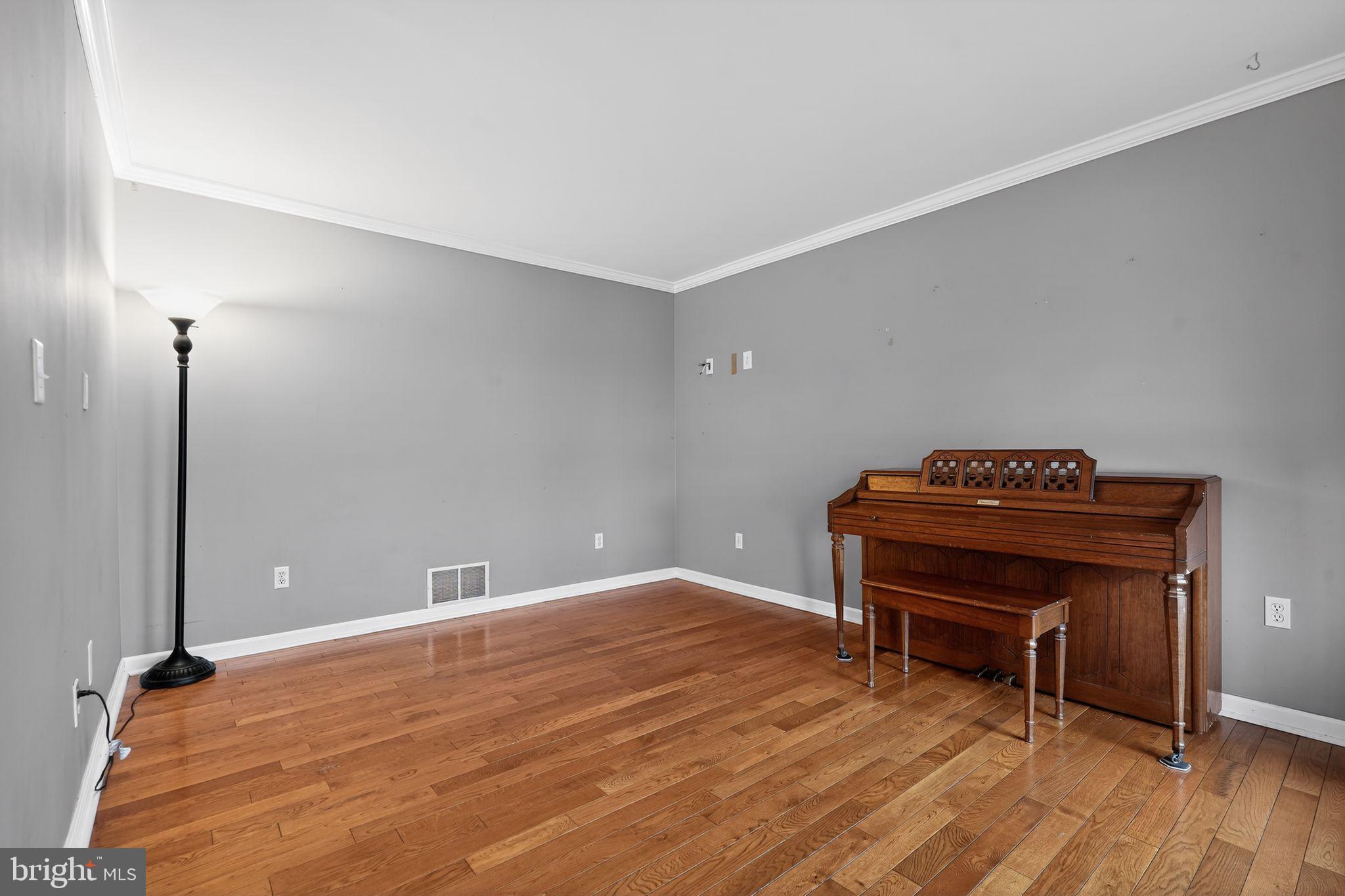 740 Carpenter Street Glassboro, NJ 08028 - Photo 10 of 44 Spacious room with warm wooden floors.