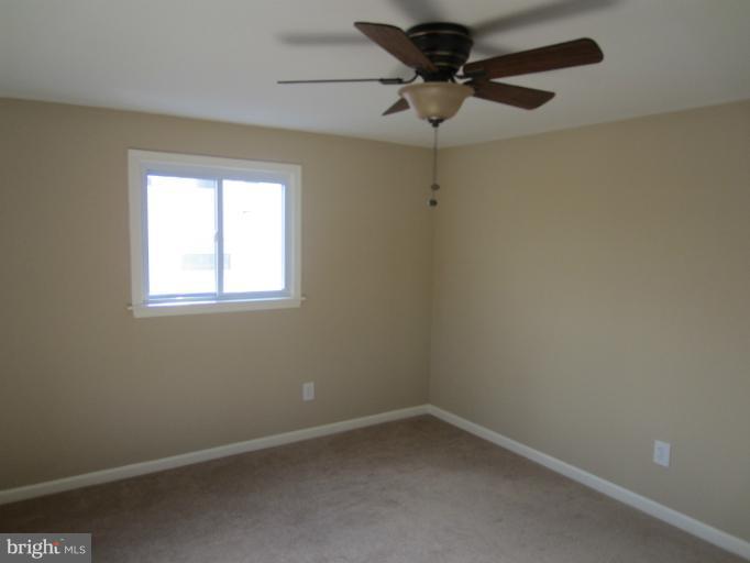 5653 Whitby Road Baltimore, MD 21206 - Photo 5 of 26 an empty room with a window