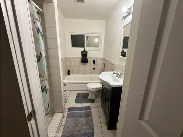 a bathroom with a sink a mirror and a shower