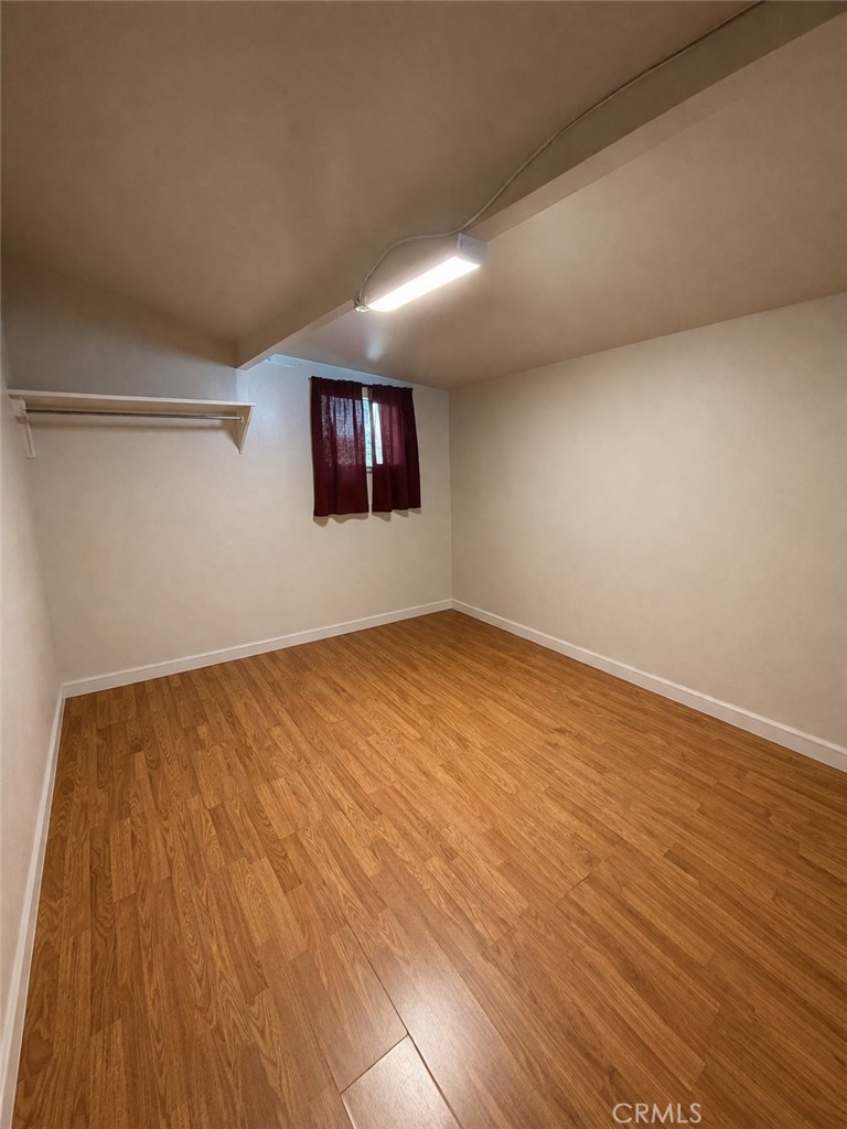 13100 Rangoon Street Arleta, CA 91331 - Photo 7 of 14 a view of empty room with wooden floor