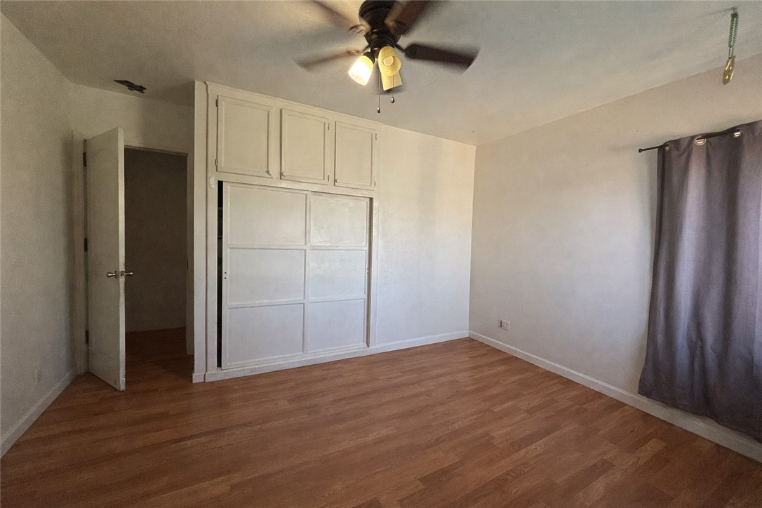 13100 Rangoon Street Arleta, CA 91331 - Photo 10 of 14 wooden floor in an empty room with a window