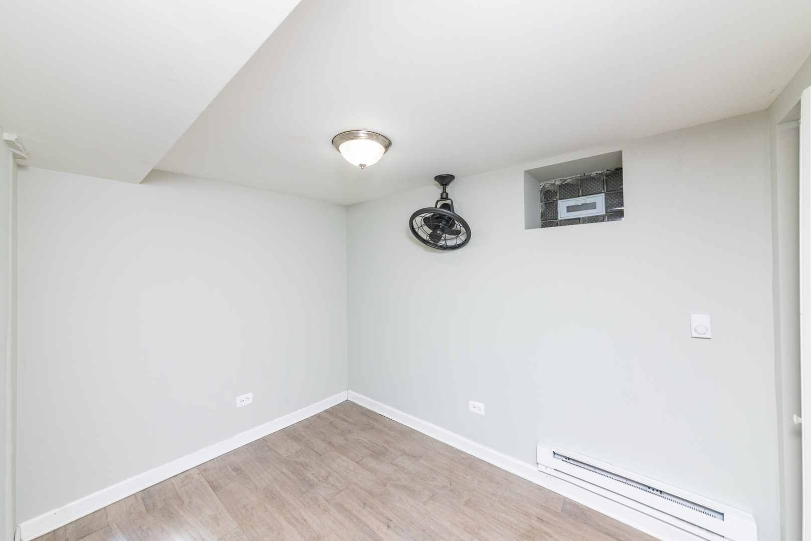1431 West Flournoy Street, Unit G Chicago, IL 60607 - Photo 12 of 12 a view of a room with a fan and wooden floor